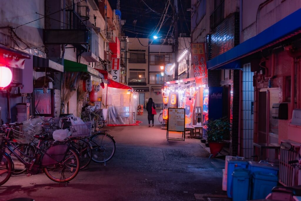 A narrow alley with a few bikes parked on the side of it